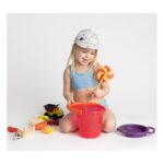 Toddler-in-Floral-Cap-Playing-with-Beach-Toys.jpg